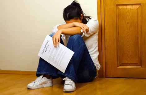 Homeowner reviewing foreclosure notice